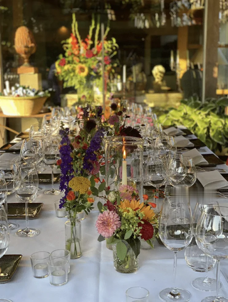 Festive table laid with flowers and candles, by Brown's Catering
